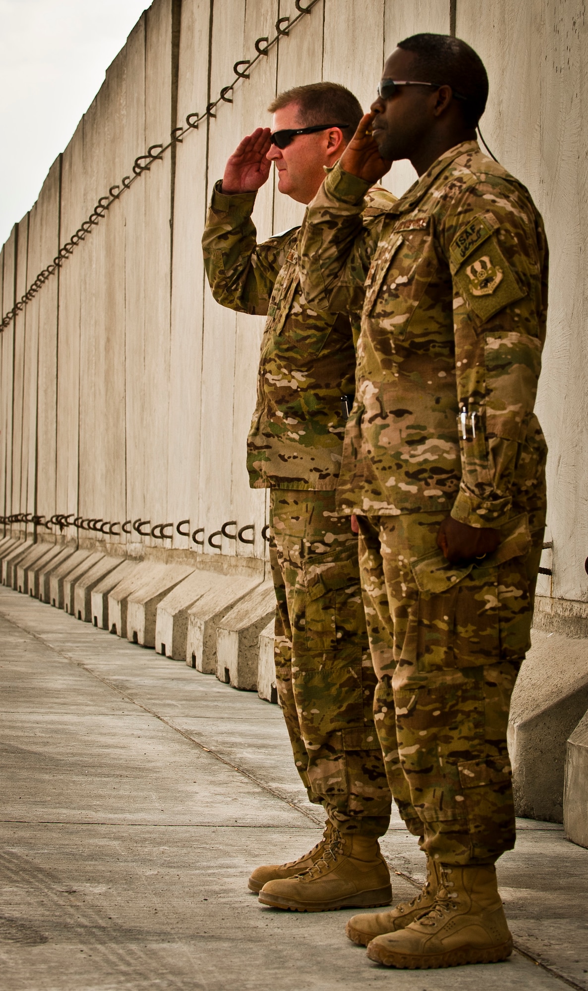 Brig. Gen. Thomas Deale, 455th Air Expeditionary Wing commander, and CMSgt Marcus Snoddy, 455th Air Expeditionary Wing command chief master sergeant, salute during the arrival of Lt. Gen. David Goldfein, Air Force Central Command commander, to Bagram Airfield, Afghanistan, June 28, 2012. (U.S. Air Force photo/Capt. Raymond Geoffroy)