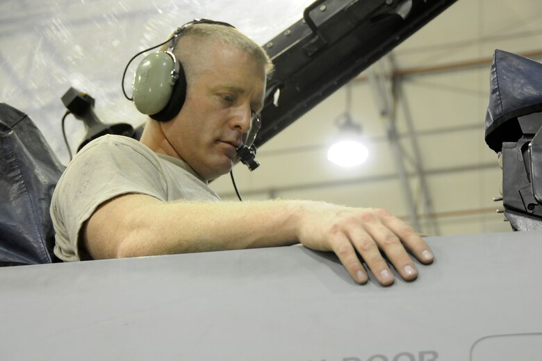 Master Sgt. Chris Mood, an electrician with the 451st Expeditionary Aircraft Maintenance Squadron at Kandahar Airfield, Afghanistan, runs tests on the electronic systems on a South Carolina Air National Guard F-16 while the jet is in the phase dock undergoing required maintenance on June 26, 2012. A phase inspection, done in the phase dock, is completed every 400 hours of flying time and is a detailed inspection of the aircraft. Members of the 169th Fighter Wing at McEntire Joint National Guard Base, S.C., are deployed to KAF in support of Operation Enduring Freedom. Swamp Fox F-16s, pilots, and support personnel began their Air Expeditionary Force deployment early April to take over flying missions for the air tasking order and provide close air support for troops on the ground in Afghanistan. (U.S. Air Force photo/Tech Sgt. Stephen Hudson)