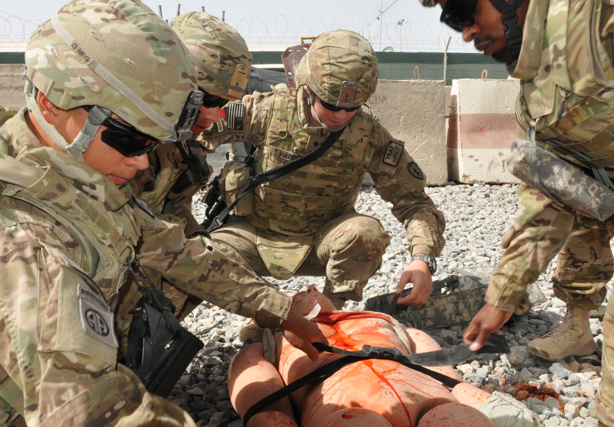 From left, Spc. Larry Harper of the 209th Aviation Support Battalion, Spc. Martin A. Cardenas, Sgt. Raul Zepeda and 2nd Lt. Andre Mathews Sr. of the 57th Expeditionary Signal Battalion (right), transport a simulated casualty during medical training at the Medical Simulation Training Center at Kandahar Airfield, June 14. Kandahar Airfield features one of only two Medical Simulation Training Centers in Afghanistan. (U.S. Army photo/Spc. Tyler Meister)
