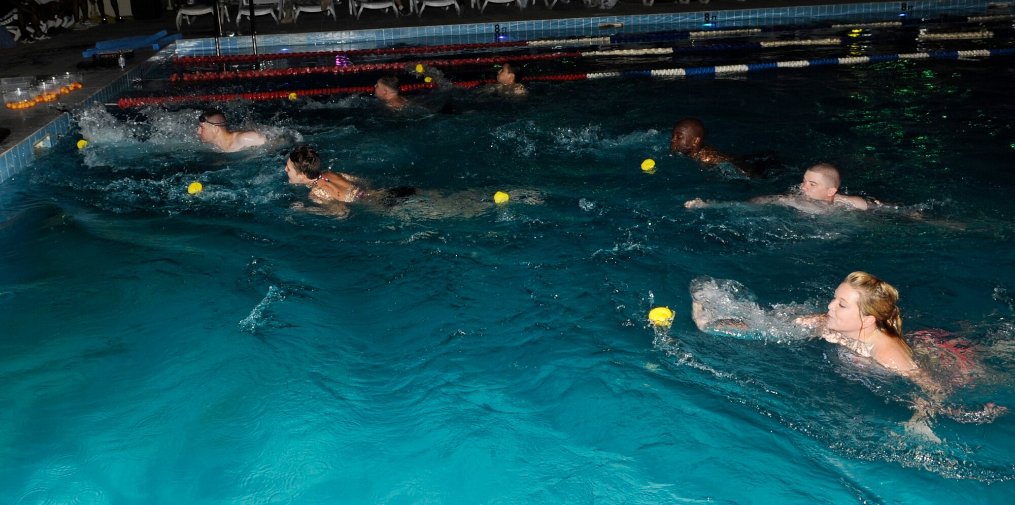 SOUTHWEST ASIA – Airmen from the 386th Air Expeditionary Wing participated in the rubber ducky race during the 101 Days of Summer Pool Party here June 23. The only rule was to get the yellow rubber duck to the other end of the pool without touching it with your body. (U.S. Air Force photo/Staff Sgt. Alexandra M. Boutte) 