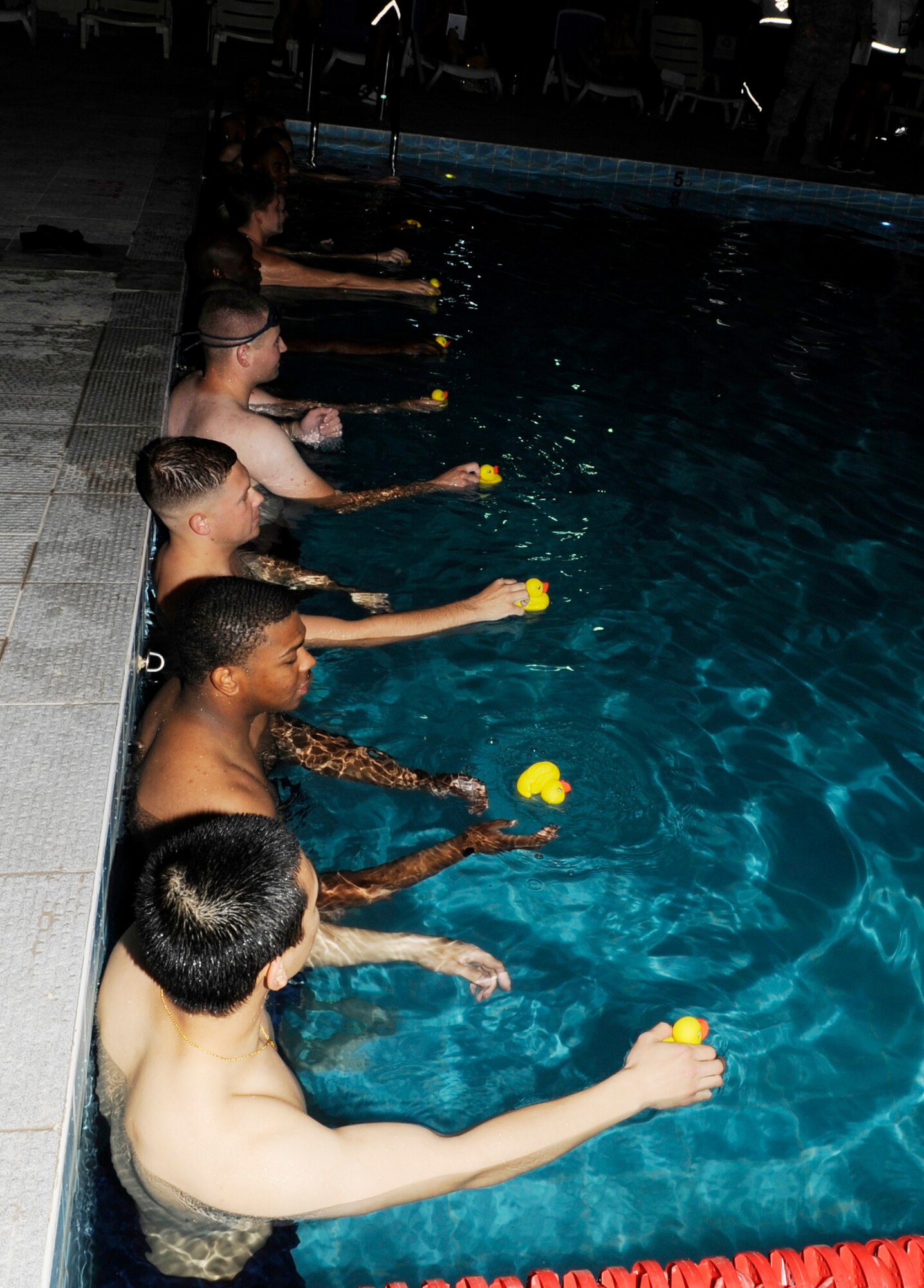 SOUTHWEST ASIA – Several 386th Air Expeditionary Wing Airmen took part in the rubber ducky race during the 101 Days of Summer Pool Party hosted by the 386th Force Support Squadron here June 23. The Airmen also participated in a noodle race and ping-pong pick-up.  (U.S. Air Force photo/Staff Sgt. Alexandra M. Boutte) 