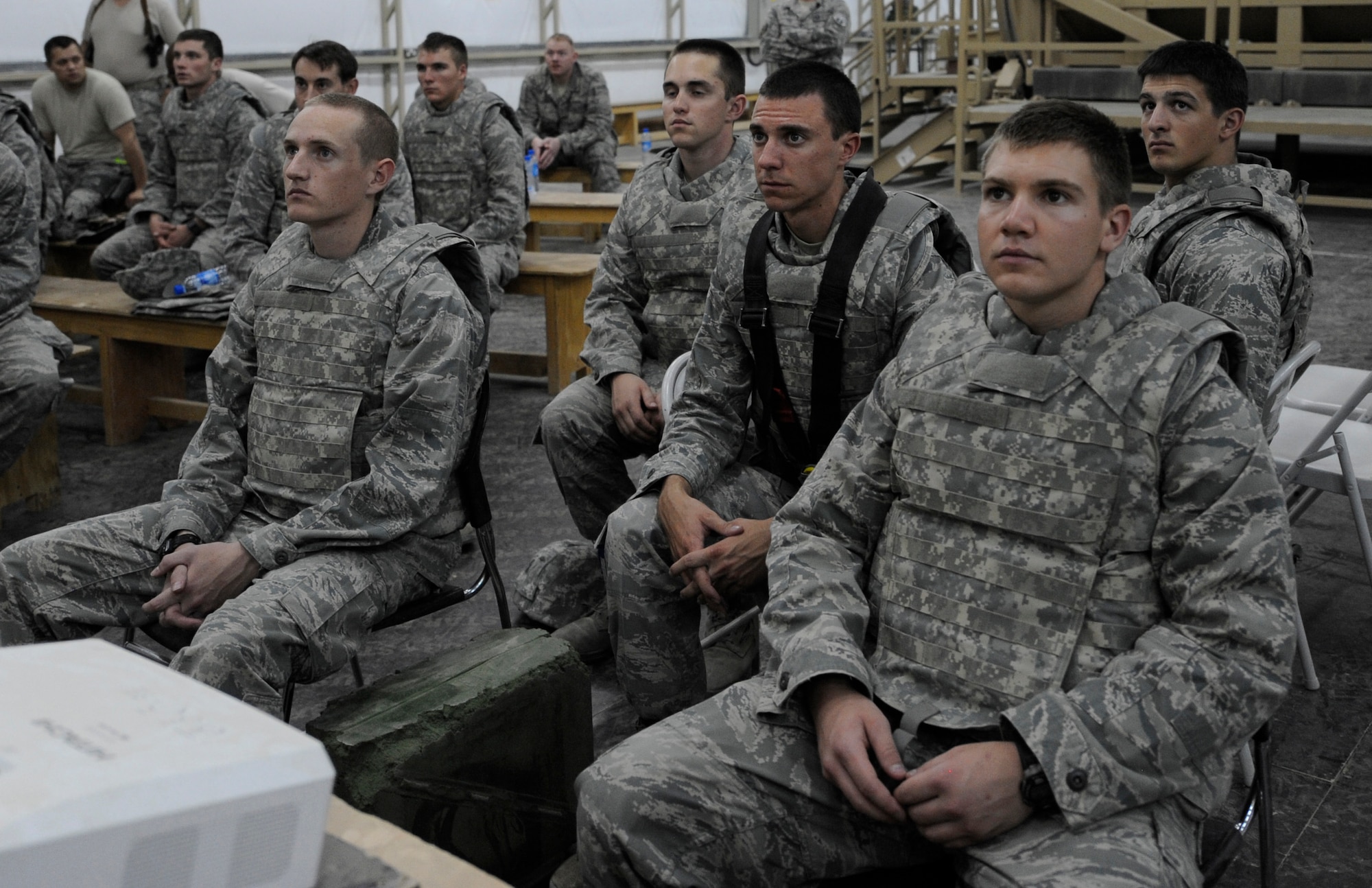 SOUTHWEST ASIA – Air Force Academy cadets sit in crew positions as if they are sitting in a mine resistant ambush protected vehicle before receiving roll-over training June 20. The cadets learned to egress from a trainer MRAP after a simulated improvised explosive device went off. (U.S. Air Force photo/Staff Sgt. Alexandra M. Boutte)