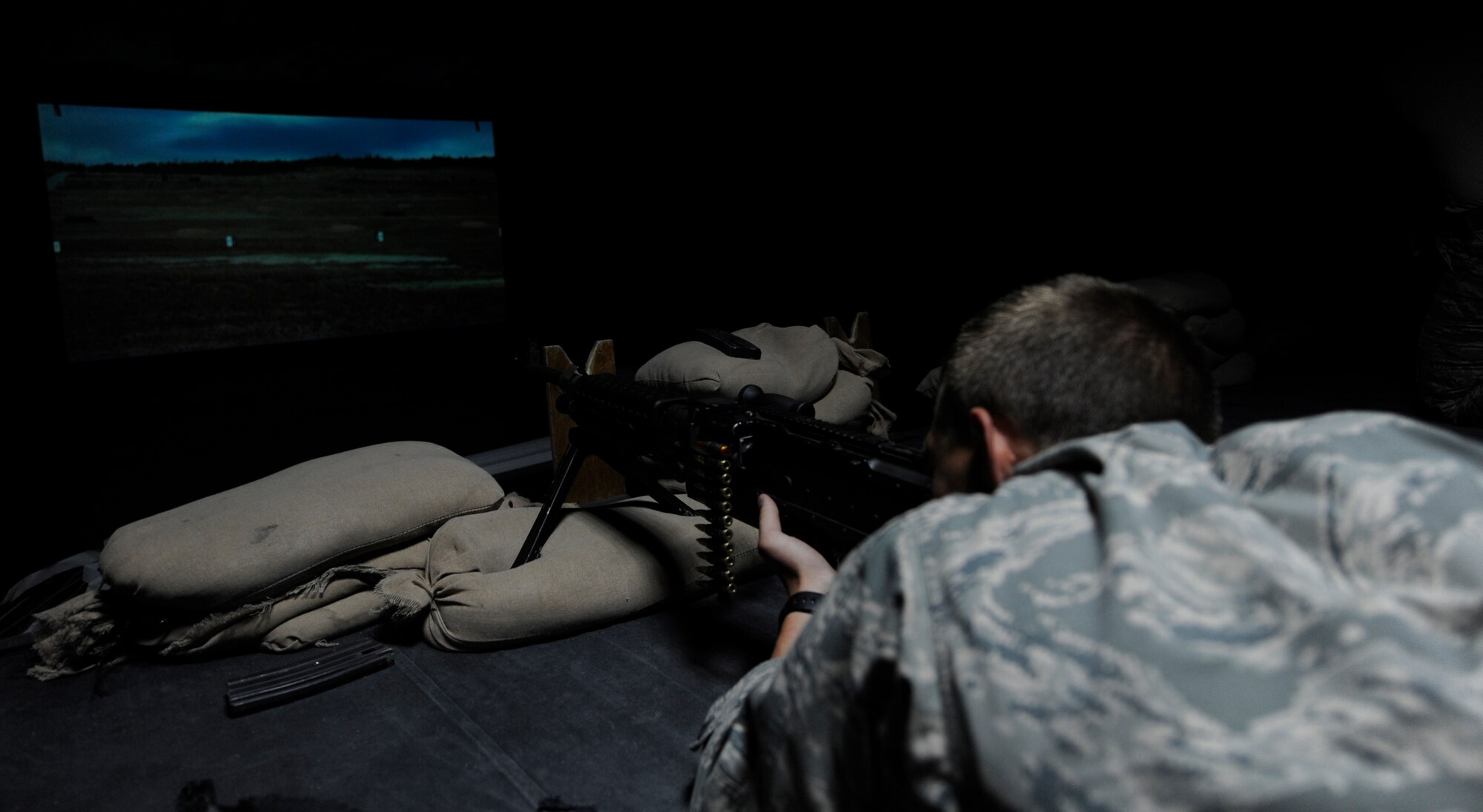 SOUTHWEST ASIA – An Air Force Academy cadet shoots a M-240 training weapon during scenarios June 20. The weapons simulation trains personnel on scenarios with more precision, safety, and without cost and environmental impact of live ammunition. (U.S. Air Force photo/Staff Sgt. Alexandra M. Boutte)