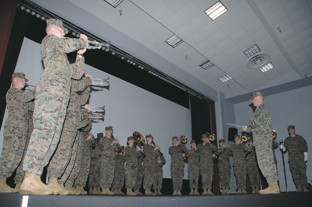 The Albany Marine Band plays its final song during its deactivation ceremony at the Base Theater, Feb. 24. The band was officially deactivated as band members performed a ceremonial casing of the colors in front of more than 100 base and tenant commands’ personnel.