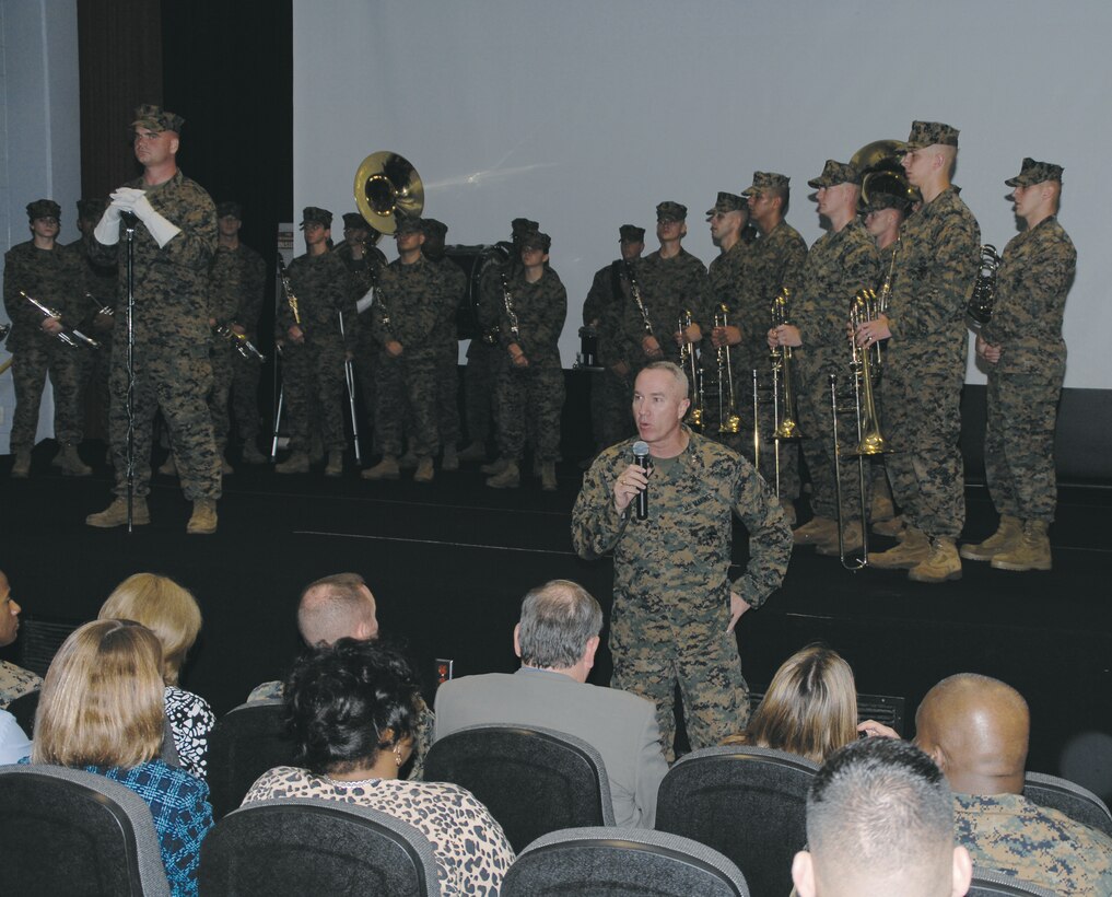 Maj. Gen. Charles L. Hudson, commanding general, Marine Corps Logistics Command, bids farewell to the Albany Marine Band during its deactivation ceremony at the Base Theater, Feb. 24.