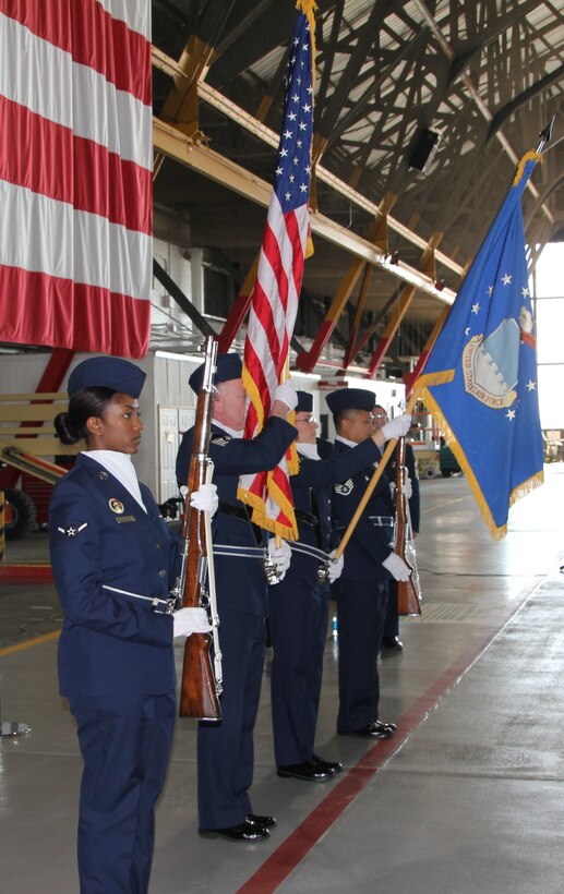 Members of the 932nd Airlift Wing honor guard at Scott AFB, Ill., present the colors during the singing of The National Anthem as part of a recent retirement ceremony. Honor guard members participate in a variety of ceremonies and other duties throughout the year. (U.S. Air Force photo/Tech. Sgt. Gerald Sonnenberg)
