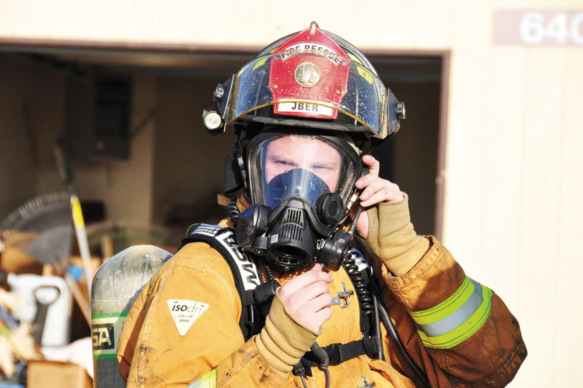 The Joint Base Elmendorf-Richardson Firefighters respond to a fire in base housing, Alaska, Sept. 28, 2011. Twenty-nine firefighters fought the blazes for more than four hours.  (U.S. Air Force photo by Maj. Joseph Coslett)