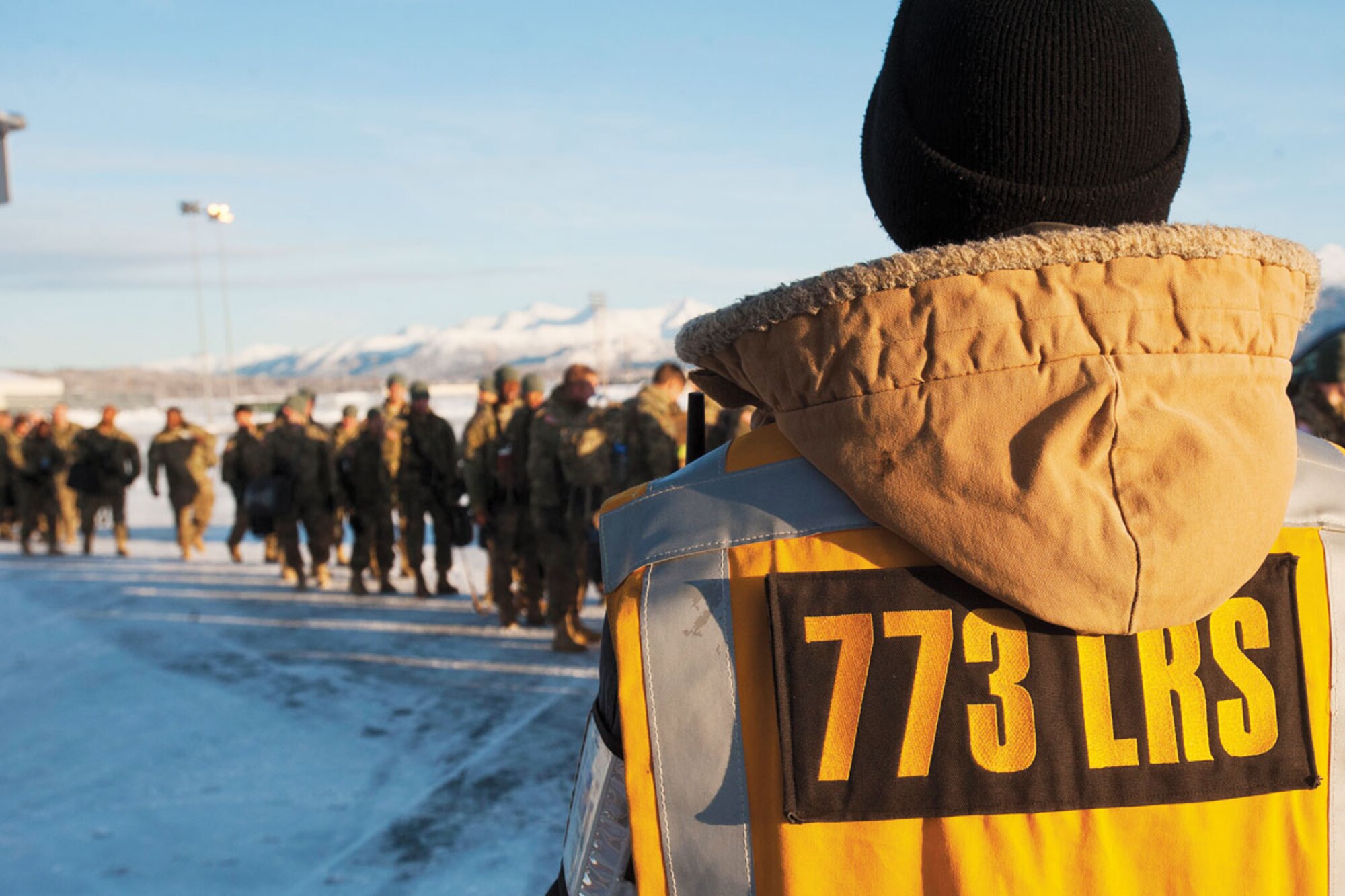 A member of the 773rd Logistics Readiness Squadron watches as Soldiers of the 4th Brigade Combat Team (Airborne), 25th Infantry Division load a Boeing 737 as they prepare to leave for a deployment to Afghanistan Nov. 28, 2011. During the period of Nov. 28 through mid-December, the 773rd LRS helped deploy more than 3,500
Soldiers as part of their mission to support U.S. Army Alaska units stationed at JBER. (U.S. Air Force photo/Senior Airman Christopher Gross)