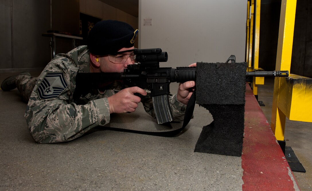 Senior Master Sgt. Eric Soluri, 28th Security Forces Squadron operations superintendent, prepares to fire an M-4 carbine at the Combat Arms Training and Maintenance on Ellsworth Air Force Base, S.D., Feb. 29, 2012. Airmen train at CATM regularly, ensuring their weapons qualification records are accurate and up-to-date. (U.S. Air Force photo by Airman 1st Class Kate Thornton/Released)