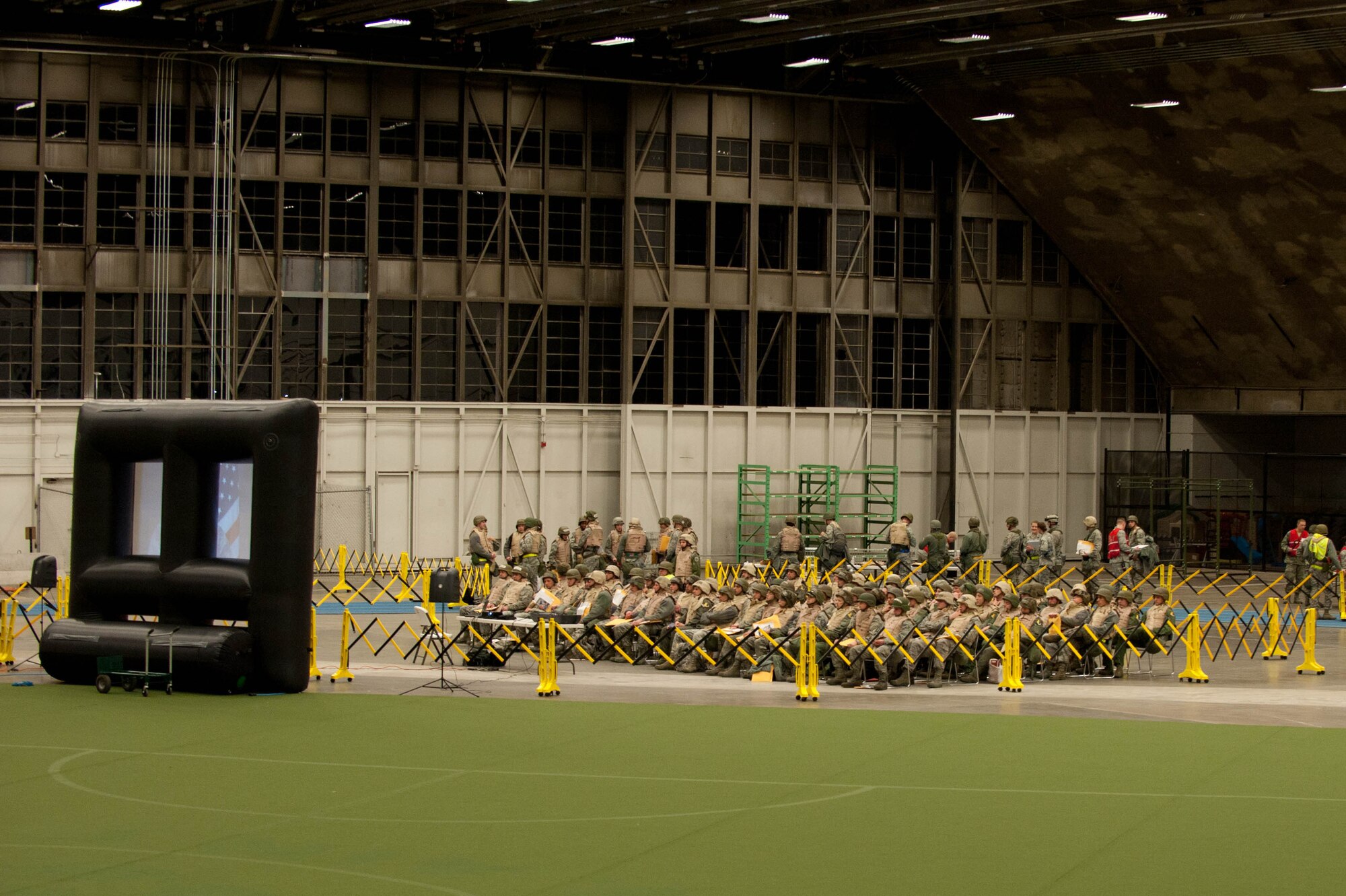Airmen receive a pre-deployment briefing at the Pride Hangar during an Operational Readiness Exercise on Ellsworth Air Force Base, S.D., Feb. 22, 2012. These briefings provided Airmen with vital information needed to meet exercise objectives. (U.S. Air Force photo by Airman 1st Class Zachary Hada/Released)