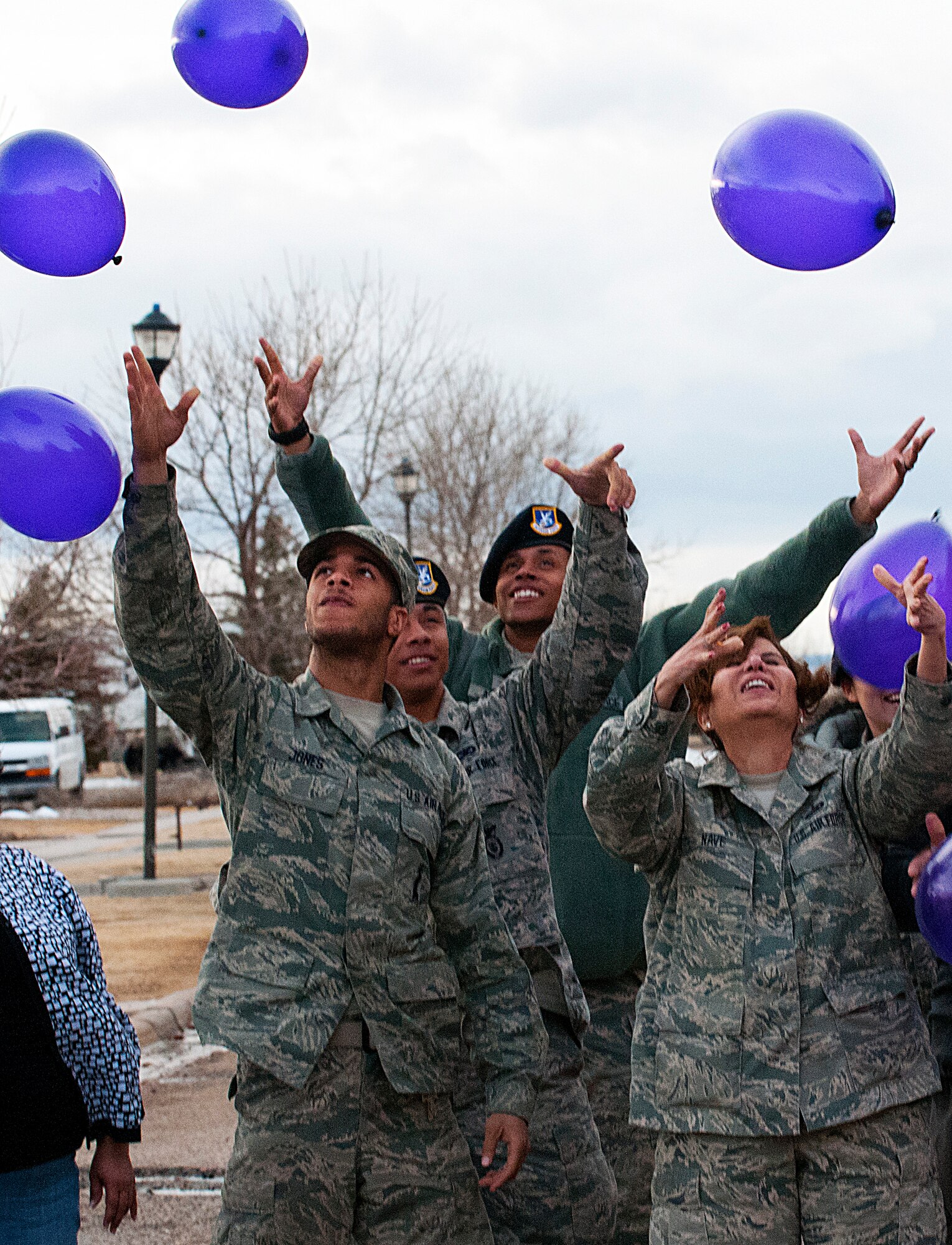 Participants in the Teen Dating Violence Awareness and Prevention Month at the base library Feb. 22, release their balloons at the conclusion of the discussion designed to raise awareness of teens in abusive relationships. (U.S. Air Force photo by R.J. Oriez)