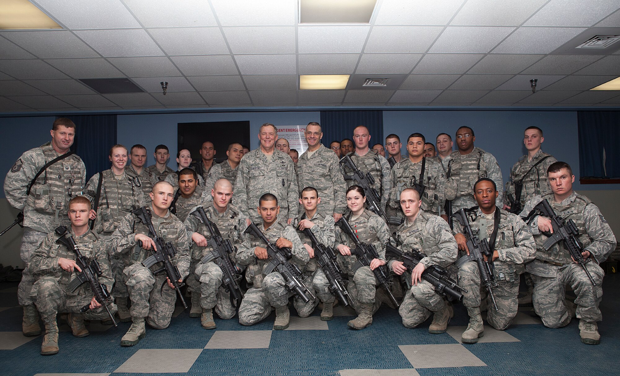 Maj. Gen. C. Donald Alston, 20th Air Force commander, and Chief Master Sgt. David Nordel, 20th AF command chief, make time for a group photograph with 90th Security Forces members after observing Guardmount Feb. 22. during Alston’s visit to the Mighty Ninety. (U.S. Air Force photo by Matt Bilden)