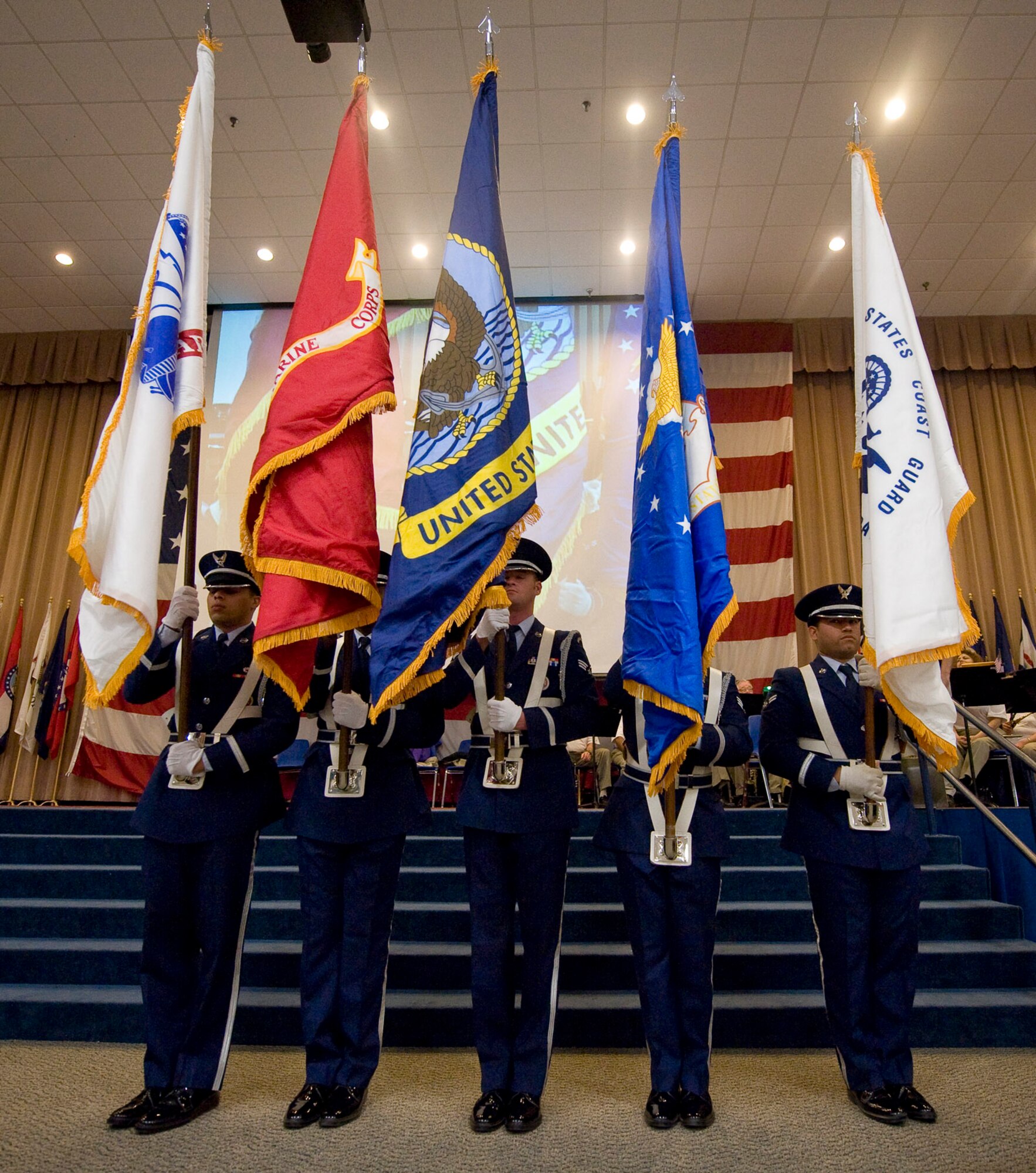 Five service flags are displayed by the Barksdale Honor Guard during the World War II veterans luncheon on Barksdale Air Force Base, La., Feb. 24. The annual event, organized by the Barksdale retiree office, honors the contributions made to the war effort by members of all five of the armed services. (U.S. Air Force photo/Senior Airman Chad Warren)(RELEASED)
