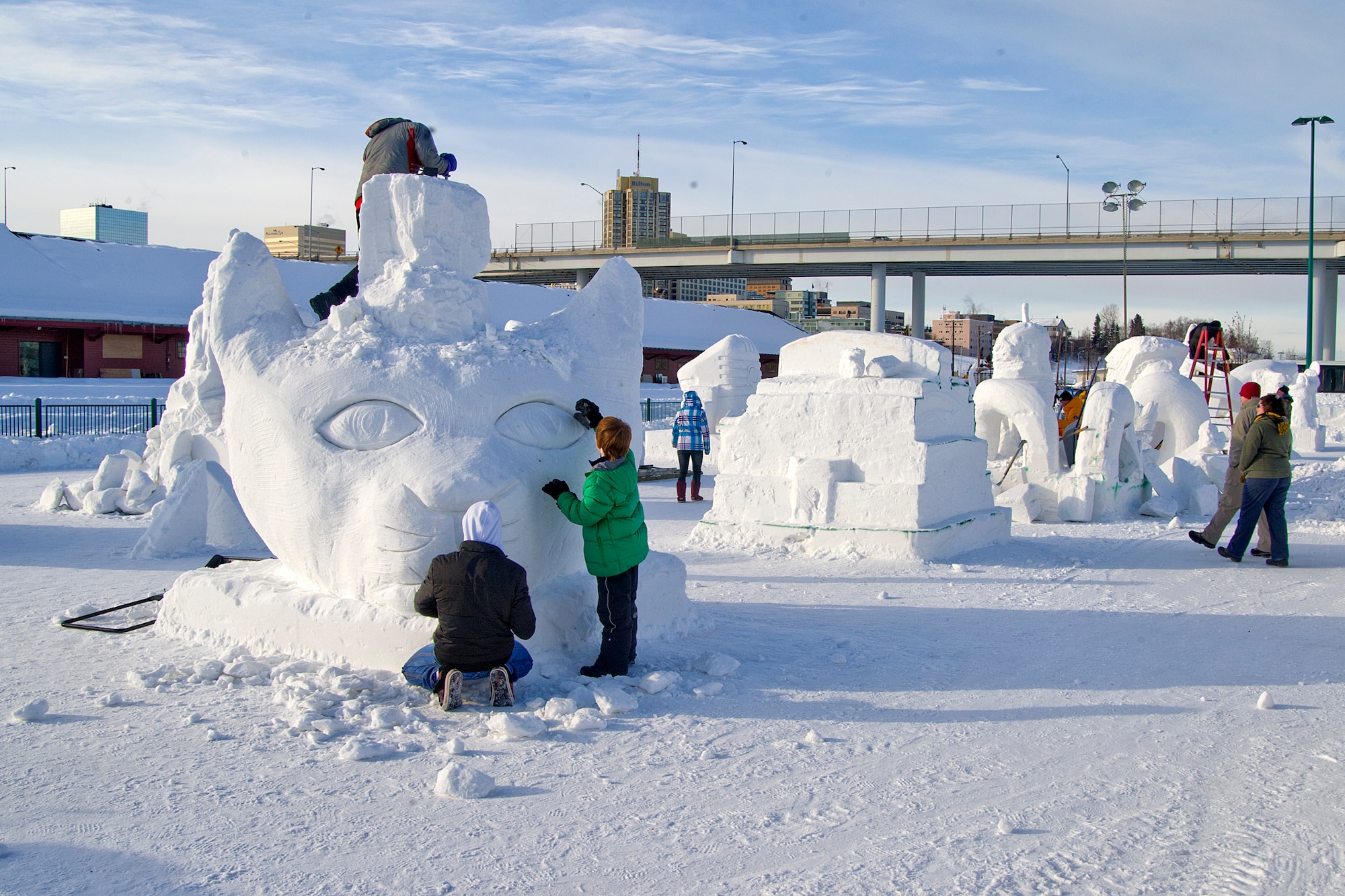 Competitors sculpt snow into art during the snow sculpting competition in Anchorage, Alaska, Feb. 25, 2012. The snow sculpting contest is part of Fur Rendezvous, a celebration that has been ongoing for 77 years. (U.S. Air Force photo/Staff Sgt. Zachary Wolf)