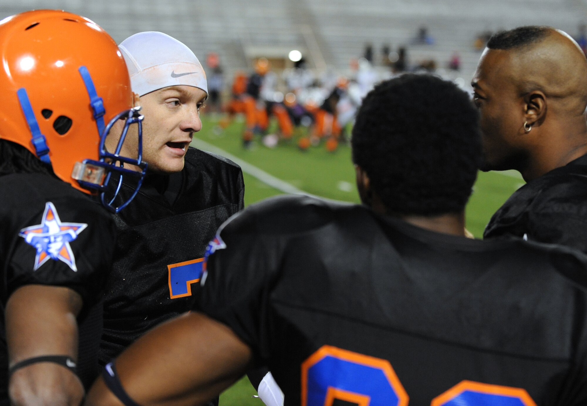 Staff Sgt. Robert Hoffman, 2nd Munitions Squadron, talks strategy with his teammates during a football game at Lee Hedges Stadium in Shreveport, La., Feb. 25. The Shreveport-Bossier Knights started their season by playing the Collin County Rattlers. The Knights' next home game is scheduled for March 17 against the Cooke County Outlaws. To find out more information about the Knights visit www.sbknights.org. (U.S. Air Force photo/Airman 1st Class Micaiah Anthony)(RELEASED)
