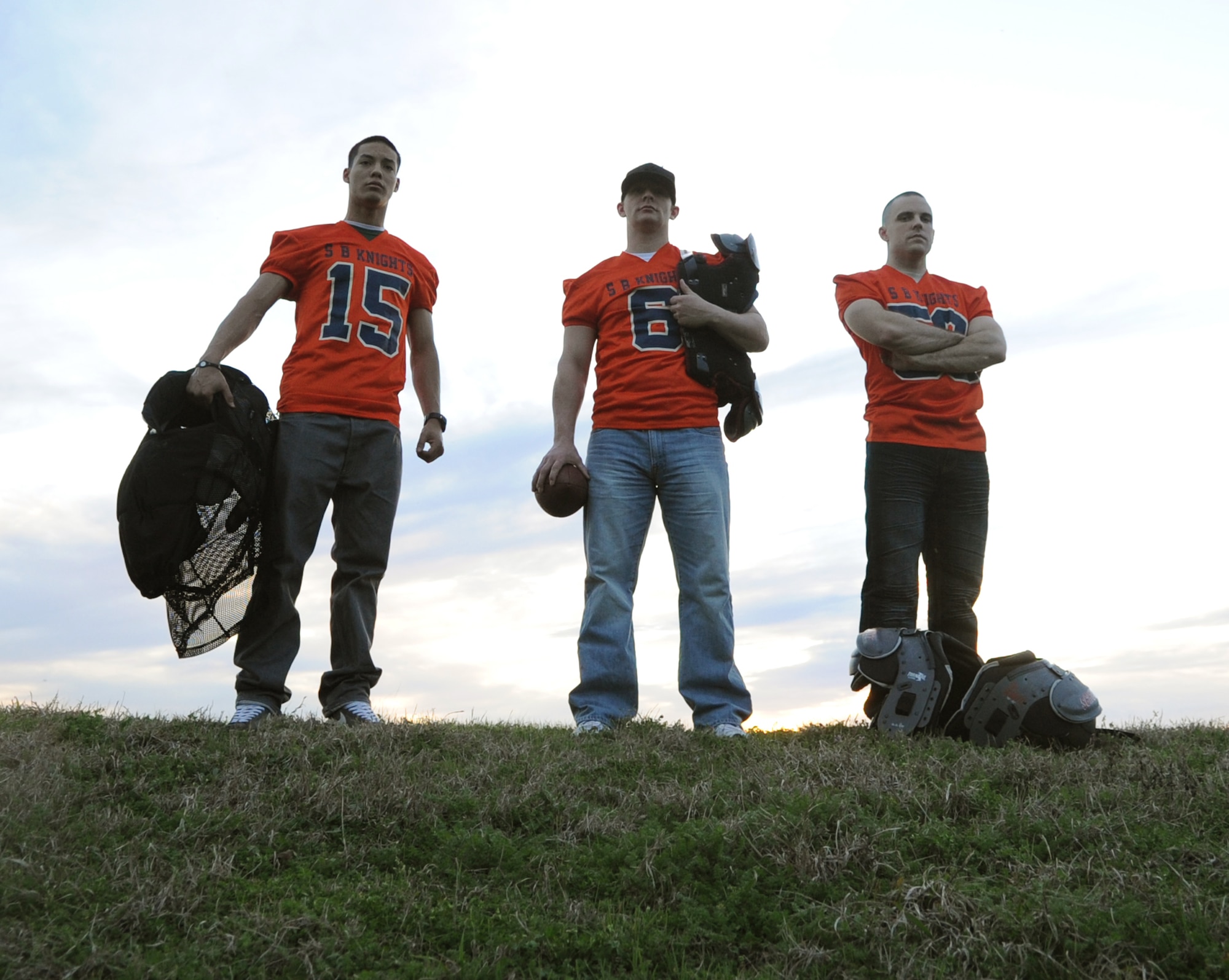 (From left to right) Airman 1st Class Joseph Palacio, Staff Sgt. Robert Hoffman and Staff Sgt. Daniel Wass, 2nd Munitions Squadron, wait for the start of their football practice on Barksdale Air Force Base, La., Feb. 23. Barksdale has four Airmen playing for the Shreveport-Bossier Knights, a minor professional football team. Though the Knights season has already started, they are still looking for talented players to add to their team. For more information about the Knights visit www.sbknights.org. (U.S. Air Force photo/Airman 1st Class Micaiah Anthony)(RELEASED)
