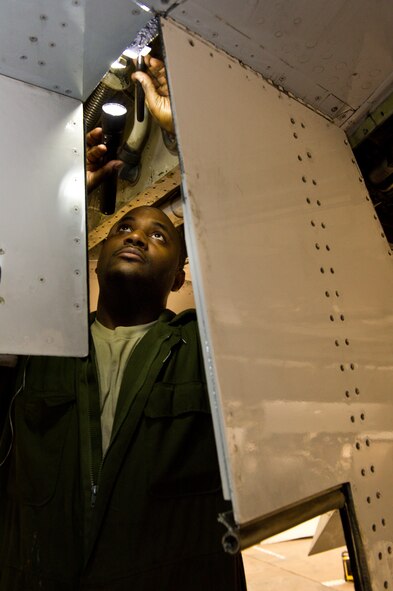 Air National Guard Staff Sgt. Breck Simmons, 116th Air Control Wing, inspects the underside of a wing on an E-8 Joint STARS during an isochronal phase inspection at Robins Air Force Base, Ga., Feb. 15, 2012.  Simmons works as a crew chief in the Phase Dock where the JSTARS aircraft undergo a thorough inspection and maintenance after a specific number of flying hours.  (National Guard photo by Master Sgt. Roger Parsons/Released)