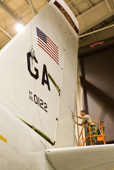 Air National Guard Senior Airman Michael Cain, 116th Air Control Wing, inspects the rudder on an E-8 Joint STARS during an isochronal phase inspection at Robins Air Force Base, Ga., Feb. 15, 2012.  Cain works as a crew chief in the Phase Dock where the JSTARS aircraft undergo a thorough inspection and maintenance after a specific number of flying hours.  (National Guard photo by Master Sgt. Roger Parsons/Released)