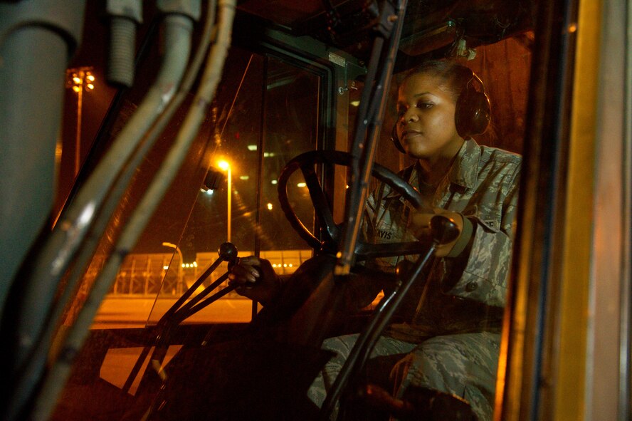 U.S. Air Force Staff Sgt. Ausha Davis, 461st Support Squadron, Logistics Flight, uses a 10K forklift to move an Individual Storage Unit ISU 70 at Robins Air Force Base, Ga., Feb. 15, 2012.  Davis works the nightshift where she ensures maintenance personnel working on the E-8 Joint STARS have the parts they need.   (National Guard photo by Master Sgt. Roger Parsons/Released)