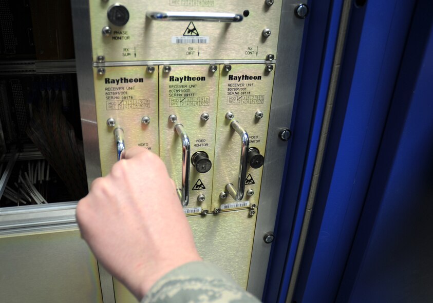 U.S. Air Force Airman 1st Class Greg Stanley, 27th Special Operations Communications Squadron radar maintainer, checks an electrical circuit component of the Digital Airport Surveillance Radar at Cannon Air Force Base, N.M., Feb. 24, 2012. The DASR system will replace the existing Airport Surveillance Radar in May 2012. (U.S. Air Force photo by Airman 1st Class Alexxis Pons Abascal)