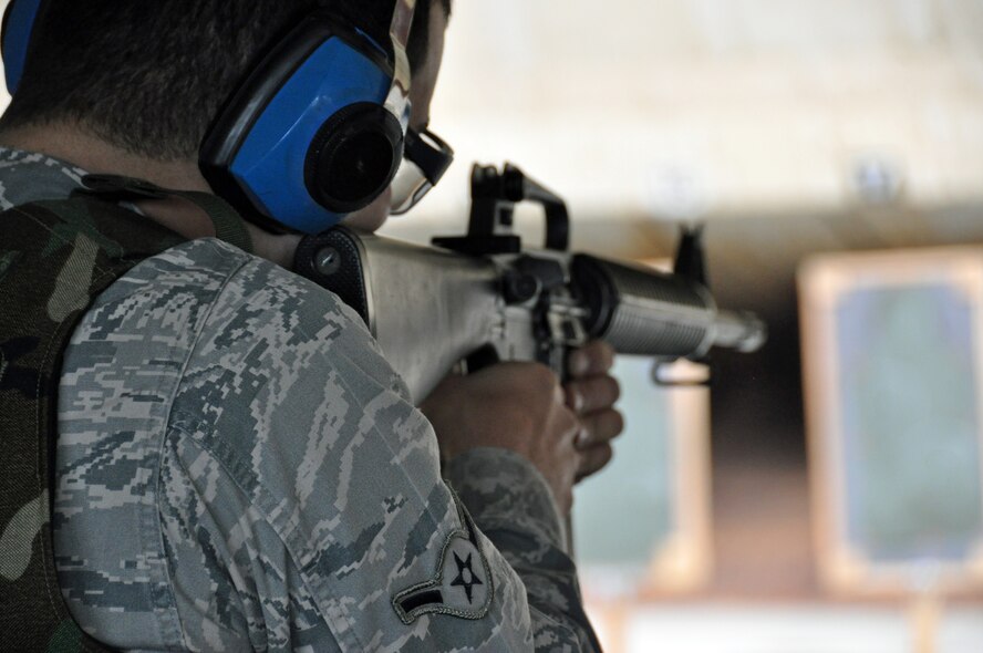 Airman Sargon Zaya, 60th Aerial Port Squadron, aims carefully and prepares to pull the trigger at the combat arms training and maintenance firing range Wednesday during his shooting qualification. (U.S. Air Force photo/Airman 1st Class Madelyn Ottem) 

