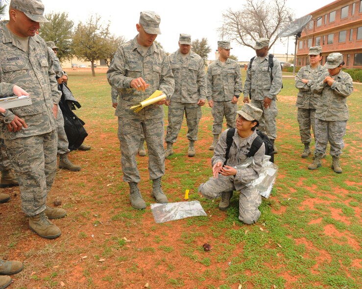 Airmen from the 7th Force Support Squadron participate in search and recovery training Feb. 27, 2012, at Dyess Air Force Base, Texas. Search and recovery training covers how to search for remains after an incident has occurred. (U.S. Air Force photo by Airman 1st Class Cierra Bullock/Released)