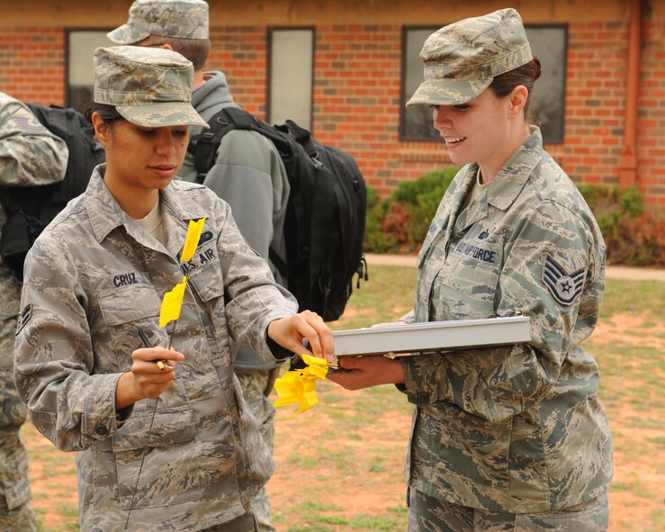 U.S. Air Force Airman 1st Class Joni Cruz, left, and Staff Sgt. Cheryl Hoelworth, right, 7th Force Support Squadron, document findings during search and recovery training Feb. 27, 2012, at Dyess Air Force Base, Texas. The training focuses on ensuring Airmen are aware of how to properly conduct search and recovery in the event of a real-world incident. (U.S. Air Force photo Airman 1st Class Cierra Bullock/Released)