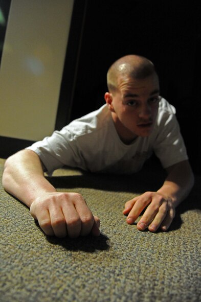 LAUGHLIN AIR FORCE BASE, Texas – A victim crawls towards a wall after a shooting spree during an active shooter exercise here Feb. 28. (U.S. Air Force photo/Senior Airman Scott Saldukas)