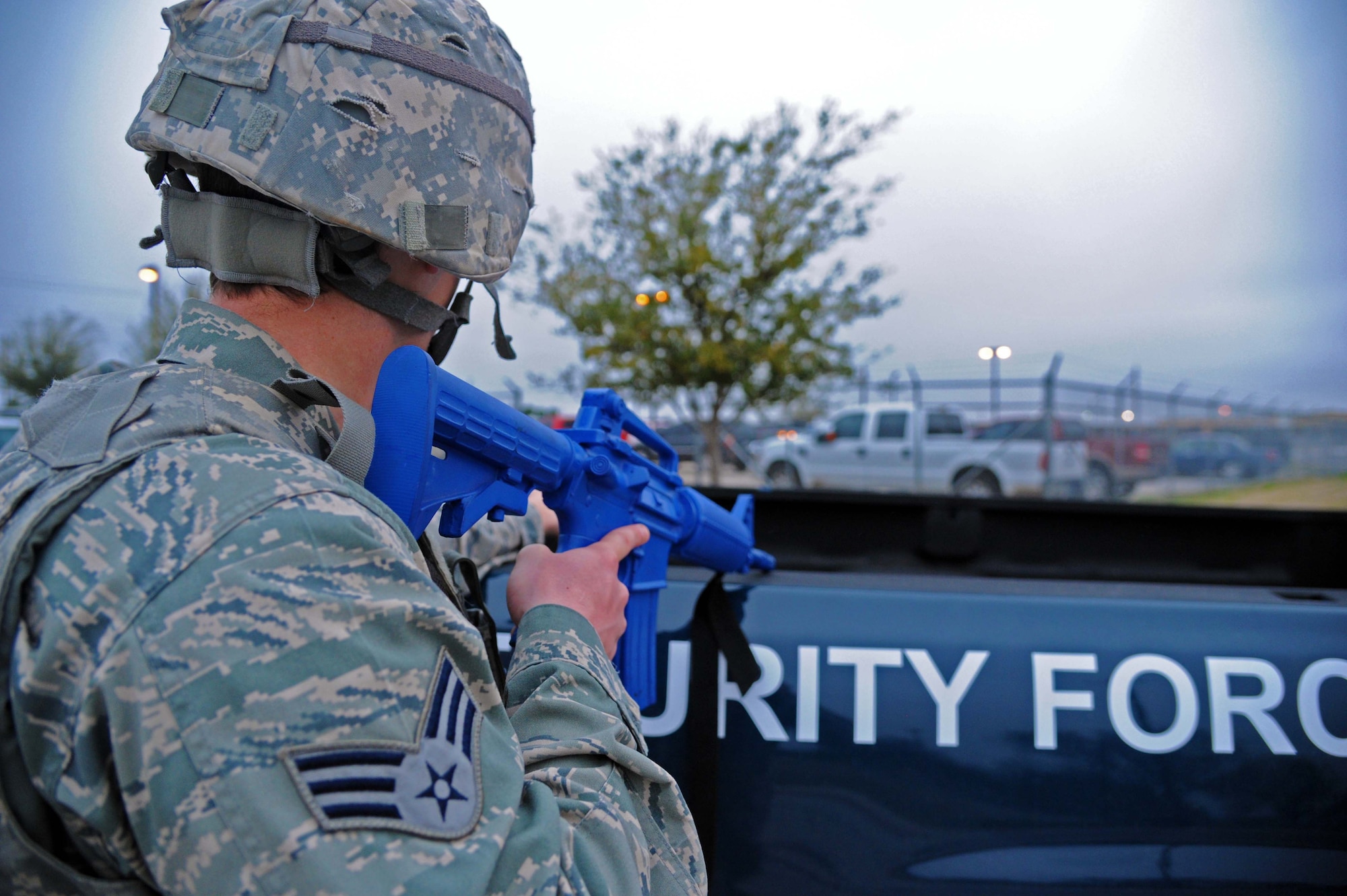 LAUGHLIN AIR FORCE BASE, Texas – A security forces member observes an incident scene from behind cover during an active shooter exercise here Feb. 28. (U.S. Air Force photo/Senior Airman Scott Saldukas)