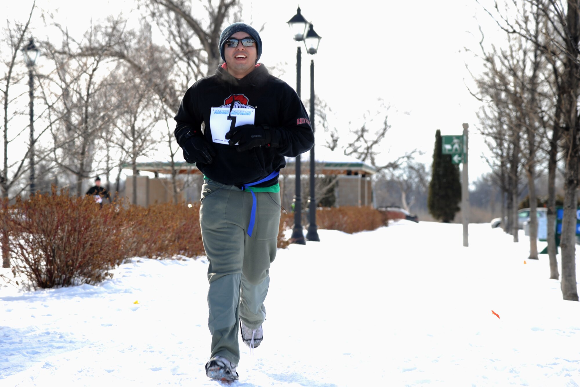 Airmen 1st Class Marco Cervantes heads toward the finish line after completing the running portion of the 3rd Annual Cold Avenger’s End It Extreme North Dakota Iceman Triathlon on Feb. 25, 2012, in downtown Grand Forks, N.D. Cervantes finished with a time of 37 minutes and 28 seconds.  (U.S. Air Force photo Airman 1st Class Xavier Navarro)