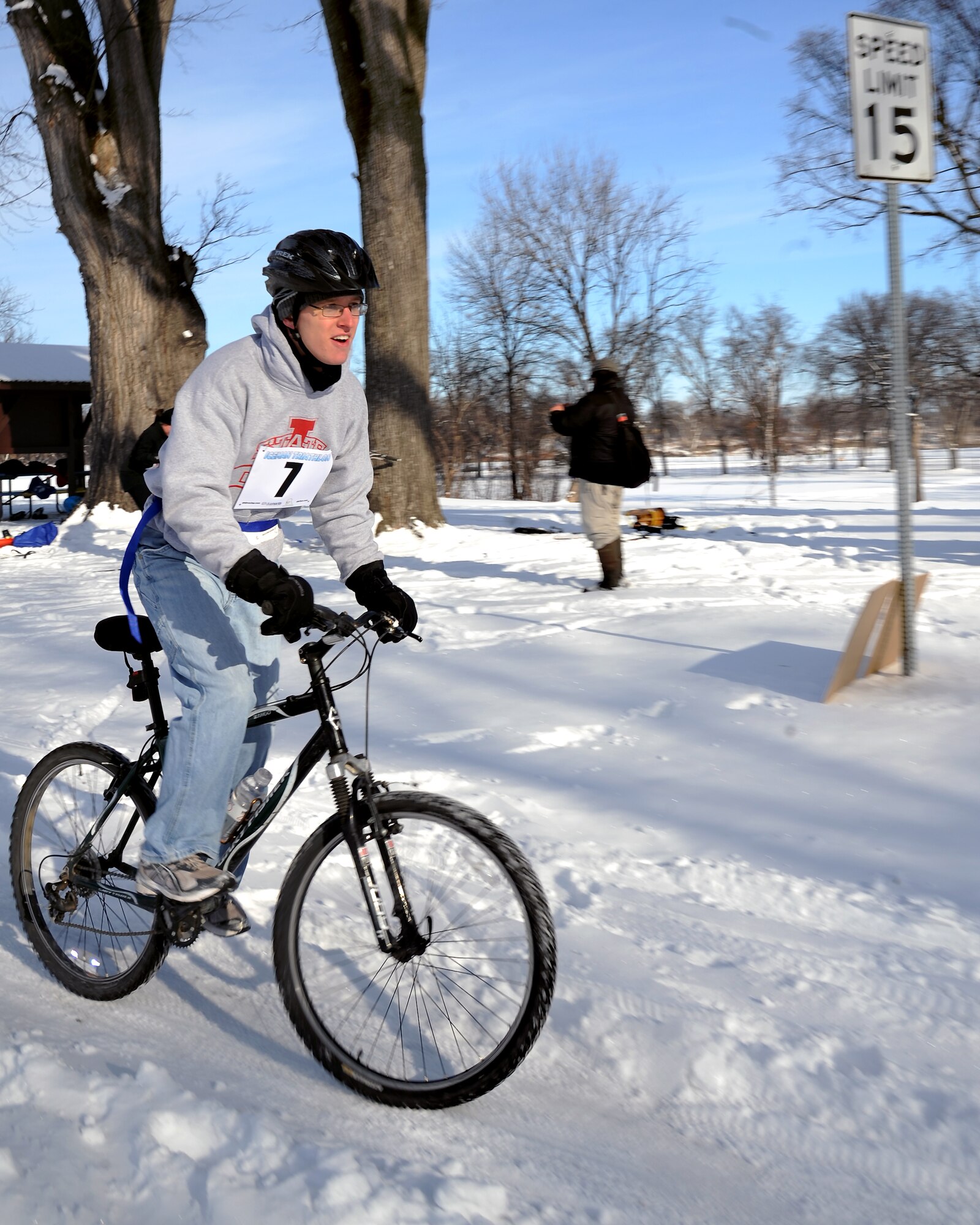 Airmen 1st Class Alex Shiverick takes off down a snow-covered trail on Feb. 25, 2012, as part of the 3rd Annual Cold Avenger’s End It Extreme North Dakota Iceman Triathlon in downtown Grand Forks, N.D. Shiverick, a pavement and equipment operator from the 319th Civil Engineer Squadron, pedaled the seven-mile long race aboard an 18-speed mountain bike cutting through up to 14 inches of snow along a trail that ran around trees, hills and over a very slippery, frozen Red River.  He finished the bike race in 46 minutes. (U.S. Air Force photo Airman 1st Class Xavier Navarro)