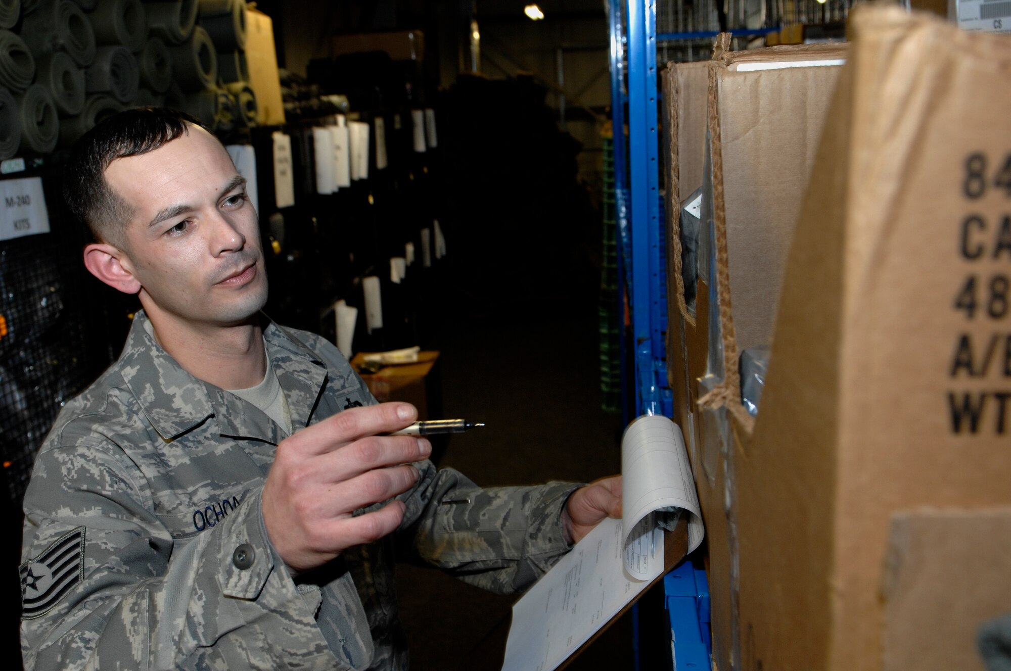 ROYAL AIR FORCE LAKENHEATH, England -- Tech. Sgt. Oscar Ochoa, 48th Security Forces Squadron resource advisor, checks equipment, Feb. 1, 2012. Ochoa was nominated for a Liberty Spotlight because he displays the core value of 'Service Before Self'. (U.S. Air Force photo by Tech Sgt. Lee Osberry) 
