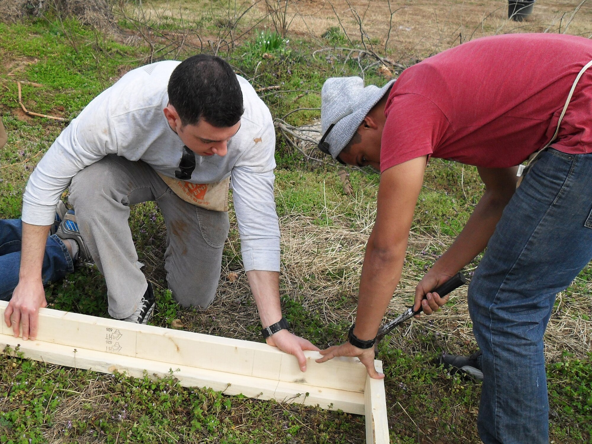 Airman 1st Class Ian Roosa, from the 96th Dental Squadron, and Airman Jonathan Quinchia, from the 96th Fuels Management Flight, work together to secure a corner of a structure in Tuscaloosa Ala., during a Habitat for Humanity trip.  The Airmen constructed two outdoor storage buildings, finalized the interior of a house, made a front porch deck, laid the base flooring for a house, cut the re-barb for a driveway and sidewalk, constructed three safe rooms and repaired one safe room capable of withstanding 200 mile per hour winds.  The 19 Airmen provided 588 man hours of labor and saved $5,800 in contractor costs over three days.  (Courtesy photo)