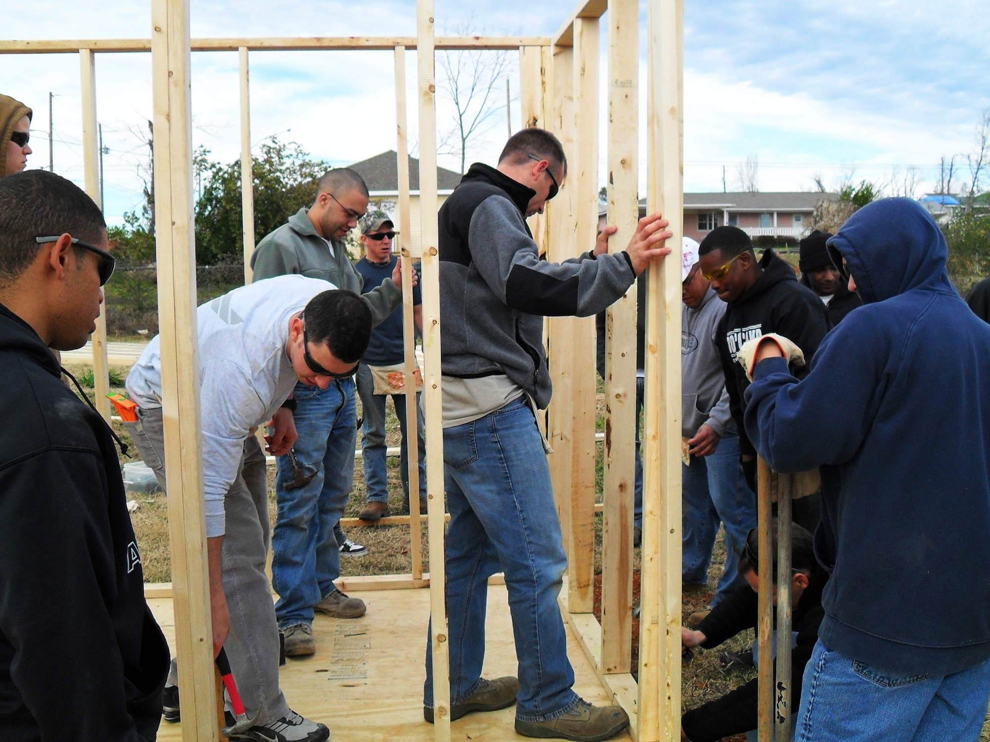 Team Eglin members erect a safe room in Tuscaloosa Ala., during a Habitat for Humanity trip.  The Airmen, from the Fuels Management Flight and the 96th Dental Squadron, constructed two outdoor storage buildings, finalized the interior of a house, made a front porch deck, laid the base flooring for a house, cut the re-barb for a driveway and sidewalk, constructed three safe rooms and repaired one safe room capable of withstanding 200 mile per hour winds.  The 19 Airmen provided 588 man hours of labor and saved $5,800 in contractor costs over three days.  (Courtesy photo)
