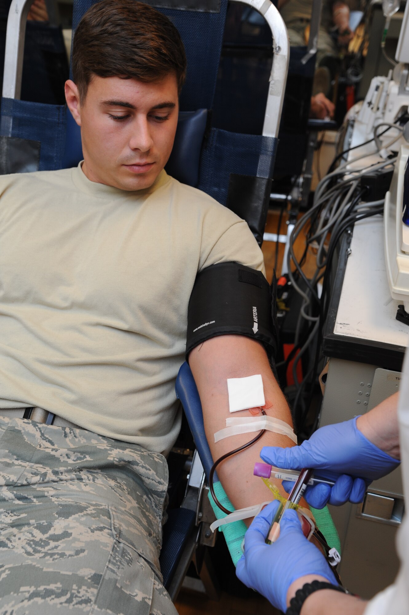 Senior Airman Jeremy Moore, 14th Communication Squadron gives blood during the blood and bone marrow drive at the fitness center on Feb. 18. In total 32 signed up for the bone marrow registry and 51 units of blood were collected. The units will make 140 blood products, 35 of which will be held for military use. (U.S. Air Force photo/Airman 1st Class Chase Hedrick)