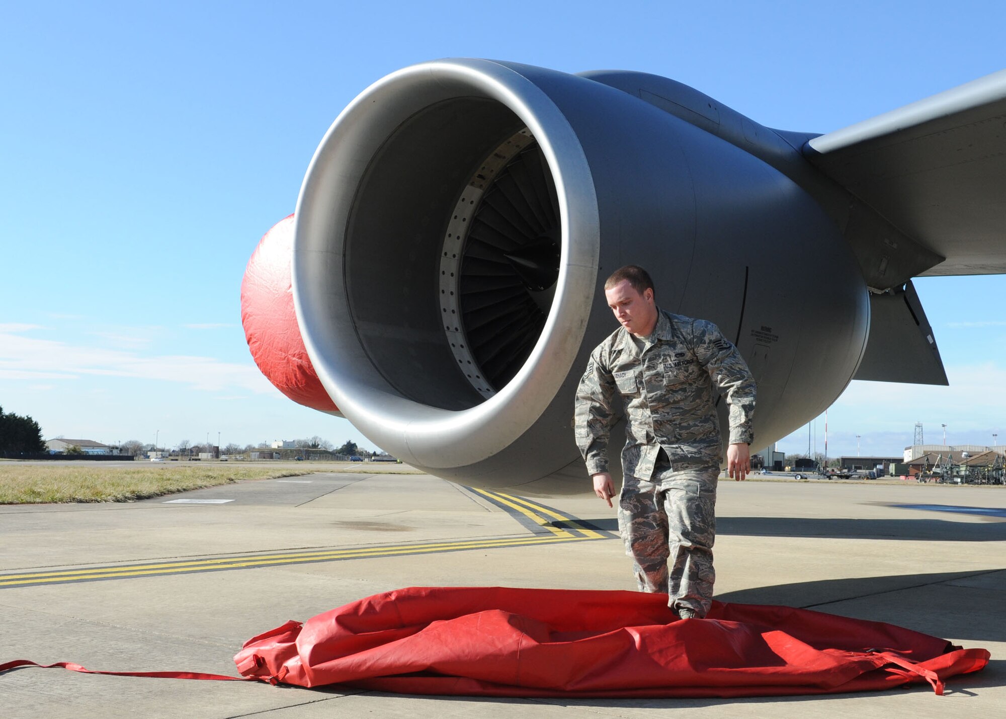 RAF MILDENHALL, England – Staff Sgt. Scott Kenady, 100th Aircraft Maintenance Squadron crew chief, removes an engine cover from a KC-135 Stratotanker aircraft here Feb. 23, 2012. Kenady works with all aircraft assigned to the 100th Air Refueling Wing but is the dedicated crew chief for the wing’s flagship aircraft. (U.S. Air Force photo/Tech. Sgt. Neal X. Joiner) 