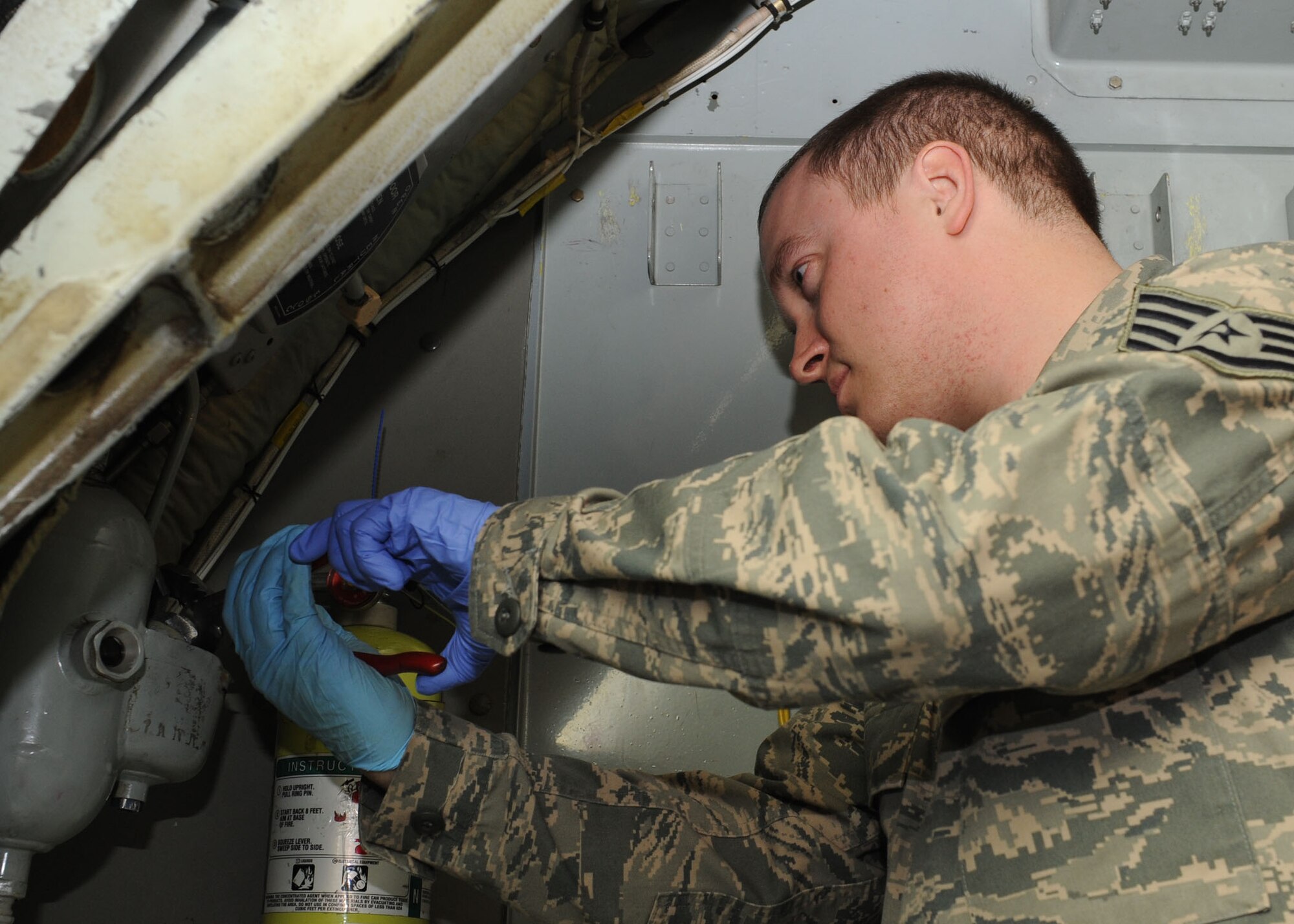 RAF MILDENHALL, England – Staff Sgt. Scott Kenady, 100th Aircraft Maintenance Squadron crew chief, conducts maintenance inside a KC-135 Stratotanker aircraft here Feb. 23, 2012. Kenady works on all aircraft assigned to the 100th Air Refueling Wing but is the dedicated crew chief for the wing’s flagship aircraft. (U.S. Air Force photo/Tech. Sgt. Neal X. Joiner) 