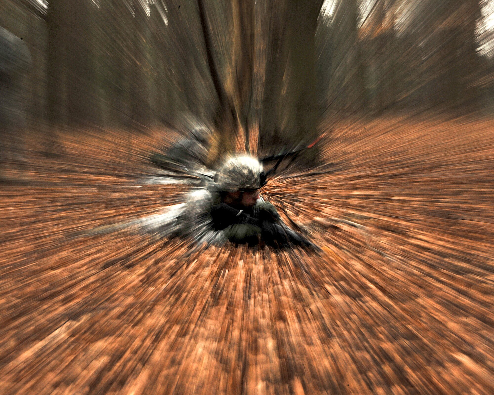 NORFOLK, England - Tech. Sgt. Brian Stokes, 100th Security Forces Squadron, drops to the prone position during a  simulated deployment mission at Stanford Training Area, Norfolk, Feb. 28, 2012. The 100th SFS assisted the Royal Air Force with pre-deployment training and conducted annual field training consisting of two days of classroom instruction and four days of hands-on training. (U.S. Air Force photo/Senior Airman Jerilyn Quintanilla)