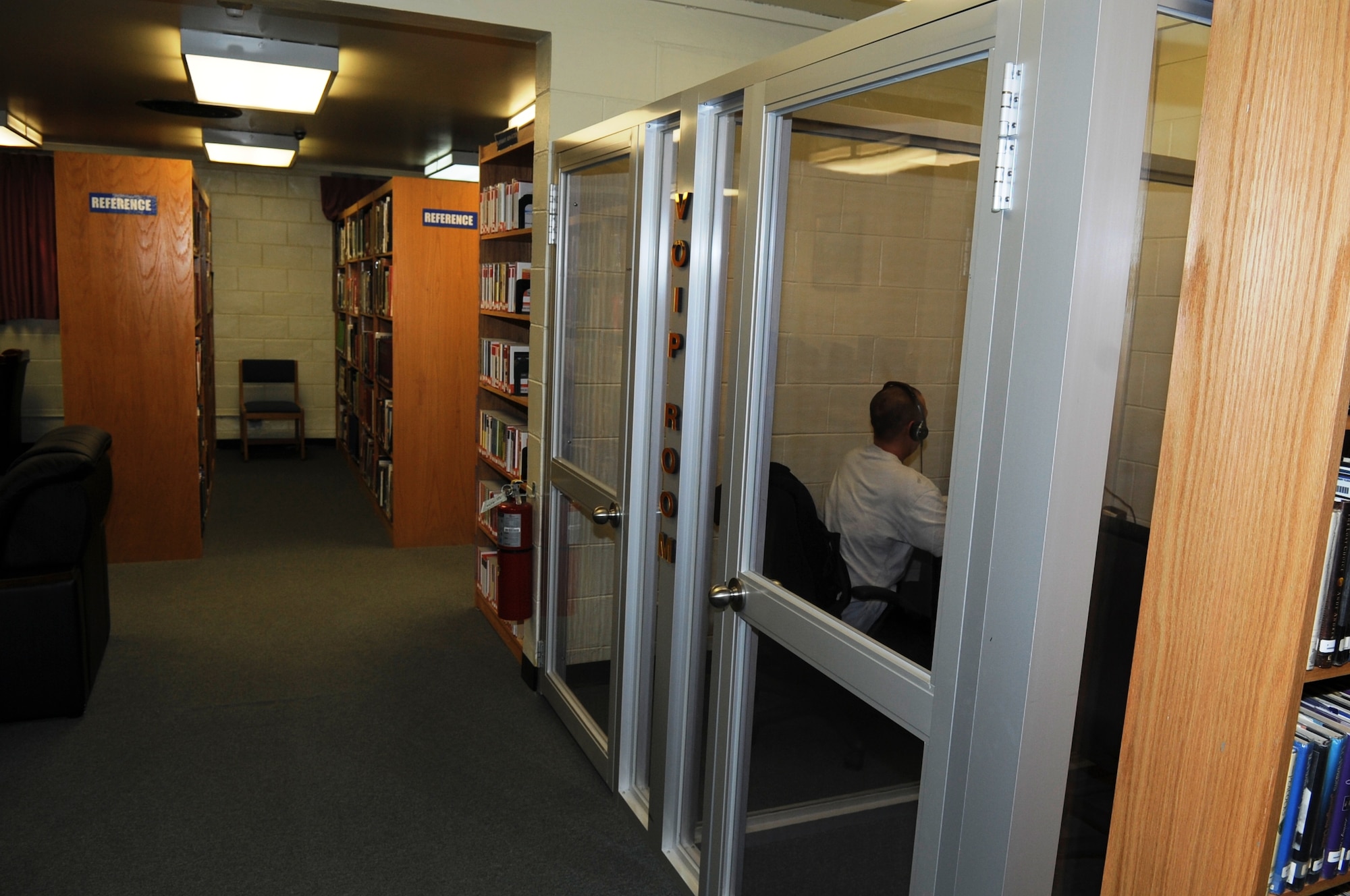 A library customer uses one of the four video chat rooms available for Airmen at the Rosenblum Memorial Library on Kunsan Air Base, Republic of Korea, Feb. 29, 2012. The Library Annex located in the Community Activity Center also offers two video chat rooms. (U.S. Air Force photo by Senior Airman Jessica Hines/Released)