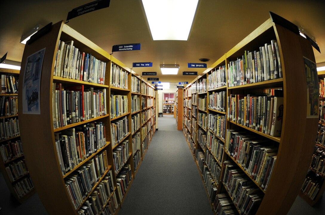 One of the several book aisles open to service members at the Rosenblum Memorial Library on Kunsan Air Base, Republic of Korea, Feb. 29, 2012.  Open since the late 1950s, the library works to keep an updated selection of reading material available for Airmen. (U.S. Air Force photo by Senior Airman Jessica Hines/Released)
