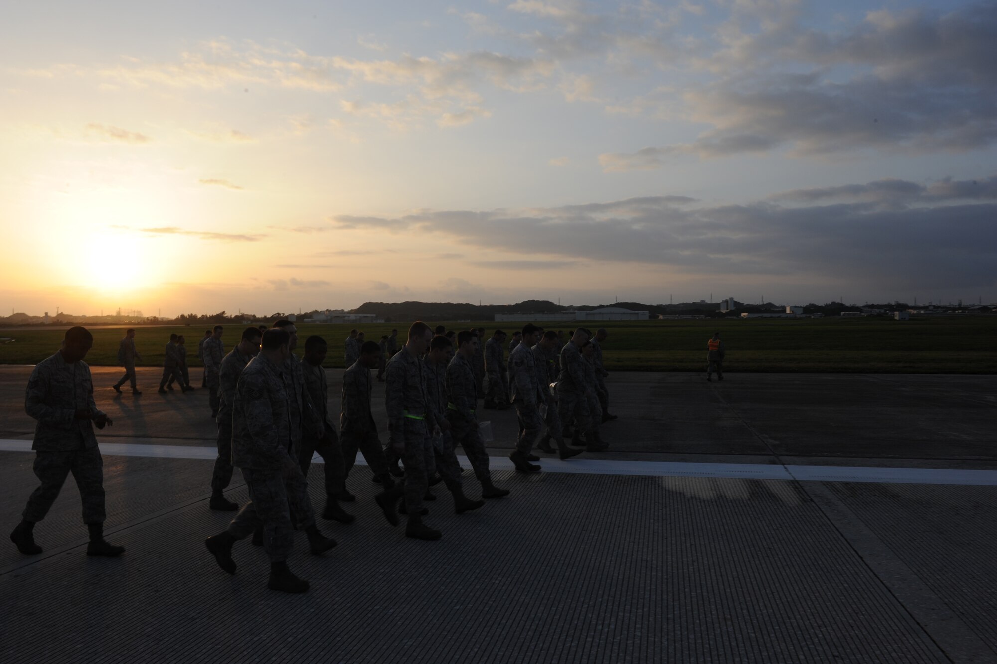 Airmen from all over Kadena Air Base, Japan participate in a Foreign Object Debris (FOD) walk on Kadena Air Base, Japan, Feb. 29, 2012. The purpose of the FOD walk is to make sure the airfield is clean and free of substances and debris that can damage an aircraft engine or airframe. (U.S. Air Force photo by Airman 1st Class Justin Veazie)