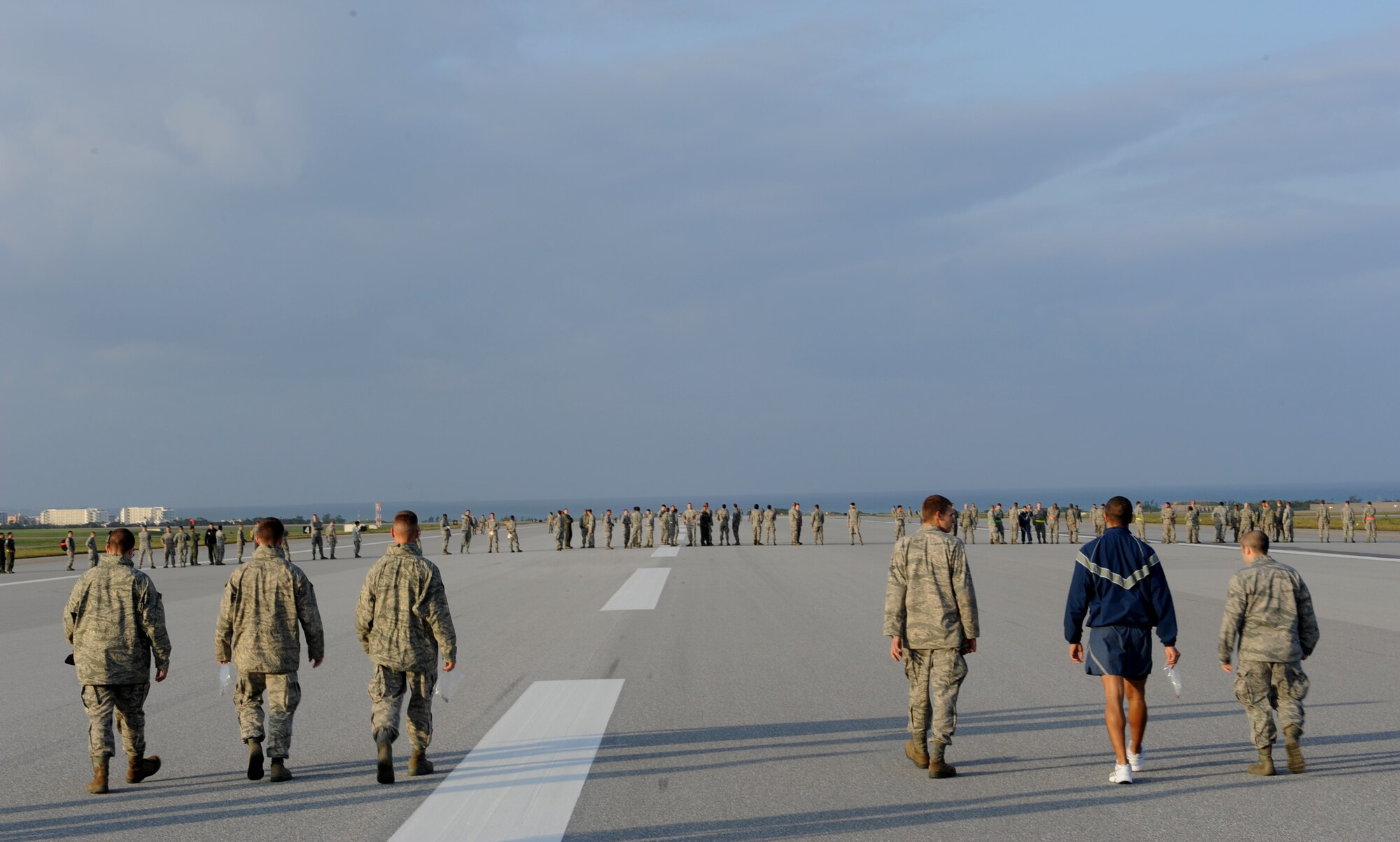 Kadena Air Base Airmen participate in the Foreign Object Debris (FOD) walk on Kadena Air Base, Japan, Feb. 29, 2012. The FOD avoidance is a task for all who work on, around or traveling through the flight line. (U.S. Air Force photo by Airman 1st Class Justin Veazie)