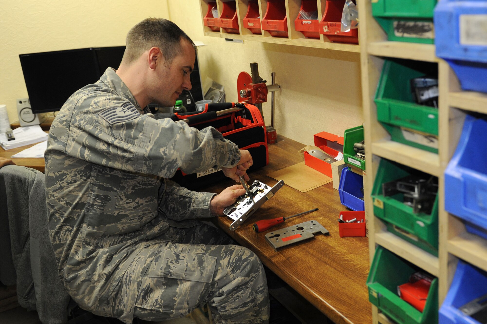SPANGDAHLEM AIR BASE, Germany - Tech. Sgt. Damon Weigl, 52nd Civil Engineer Squadron structural craftsman, conducts a function check on a mortise lock for a CE service call at Bldg. 120 here Feb. 28. The lock shop performs maintenance on safes, doors, vaults and a variety of different locks and keys. The shop provides support to Spangdahlem AB and all its geographically separated units keeping more than 1,700 facilities secure. This support keeps facilities secure keeping our base safe for air force assets and airman and their families.  (U.S. Air Force photo by Senior Airman Christopher Toon/Released)
