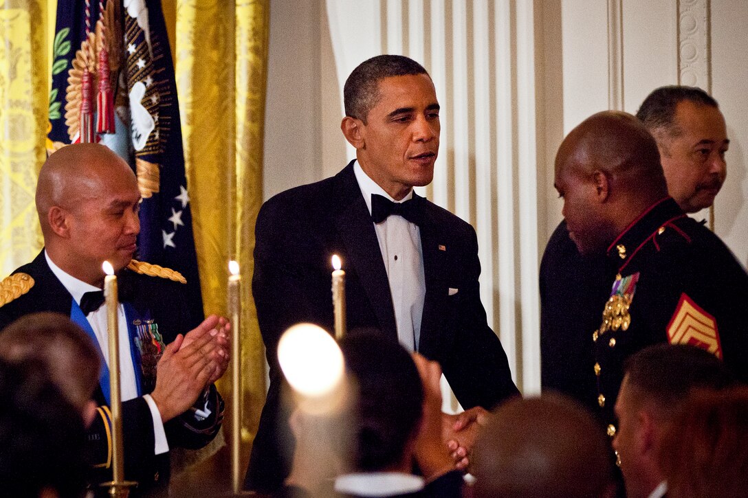 President Barack Obama shakes hands with a Marine during "A Nation's Gratitude Dinner," an event he and First Lady Michelle Obama hosted to honor Iraq War veterans at the White House in Washington, D.C., Feb. 29, 2012. DOD photo by U.S. Marine Corps Sgt. Mark Fayloga