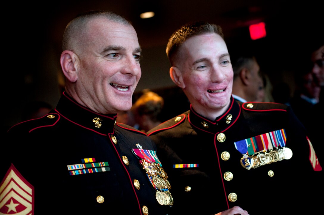 Marine Corps Sgt. Maj. Bryan B. Battaglia, senior enlisted advisor to the chairman of the Joint Chiefs of Staff, left, visits with Marine Cpl. Aaron Mankin at a reception for Iraq veterans at the Doubletree Hotel, Crystal City, Va., Feb. 29, 2012. Nearly 80 Operation Iraqi Freedom and New Dawn veterans gathered at the reception before heading to the White House for a dinner in their honor hosted by President Barack Obama.