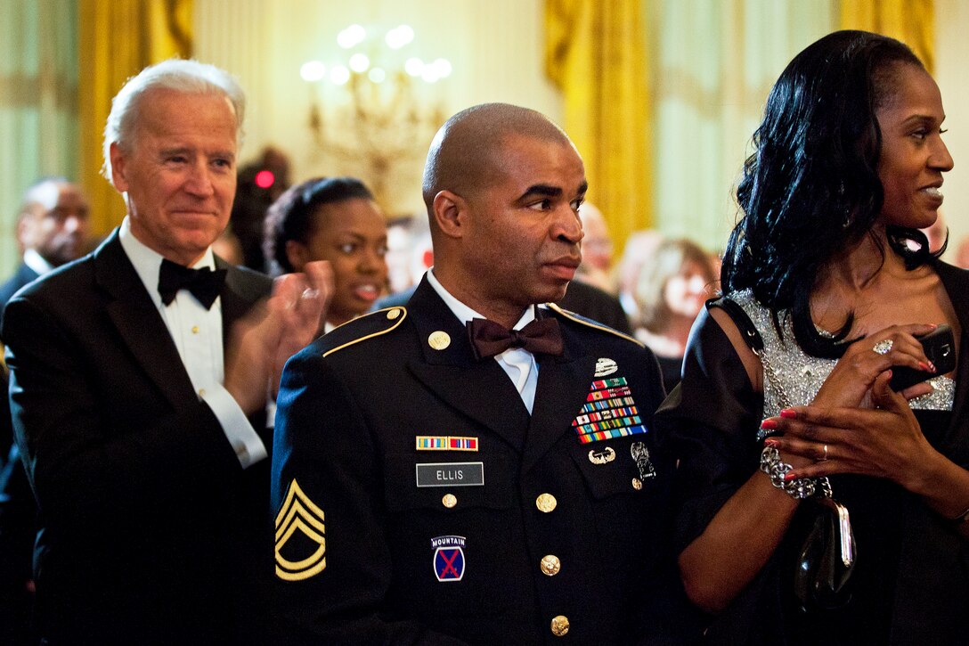 Vice President Joe Biden applauds as Army Sgt. 1st Class Sebastian K. Ellis attends "A Nation's Gratitude Dinner," an event hosted by President Barack Obama and First Lady Michelle Obama to honor Iraq War veterans at the White House in Washington, D.C., Feb. 29, 2012.
