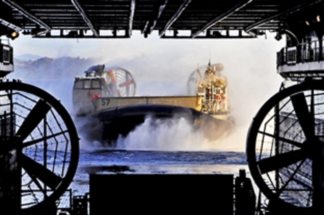 A landing craft vehicle enters the well deck of the forward-deployed amphibious assault ship USS Essex in Sasebo, Japan, Feb. 27, 2012. The Essex is the lead ship of the only forward-deployed amphibious ready group.