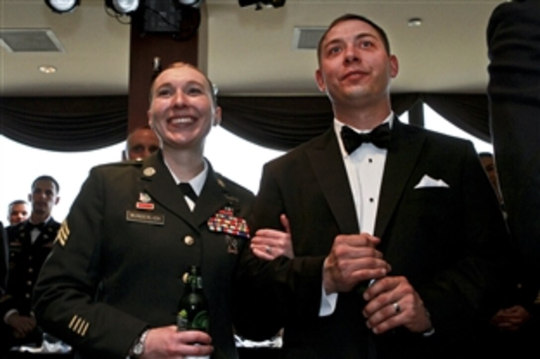 Army Sgt. Heather N. Wunderlich and her husband, Army Sgt. Jeremie Wunderlich, who served together in Iraq, relax during a reception to honor Iraq War veterans in Crystal City, Va., Feb. 29, 2012.