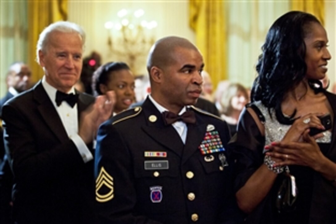 Vice President Joe Biden applauds as Army Sgt. 1st Class Sebastian K. Ellis attends "A Nation's Gratitude Dinner," an event hosted by President Barack Obama and First Lady Michelle Obama to honor Iraq War veterans at the White House in Washington, D.C., Feb. 29, 2012.

