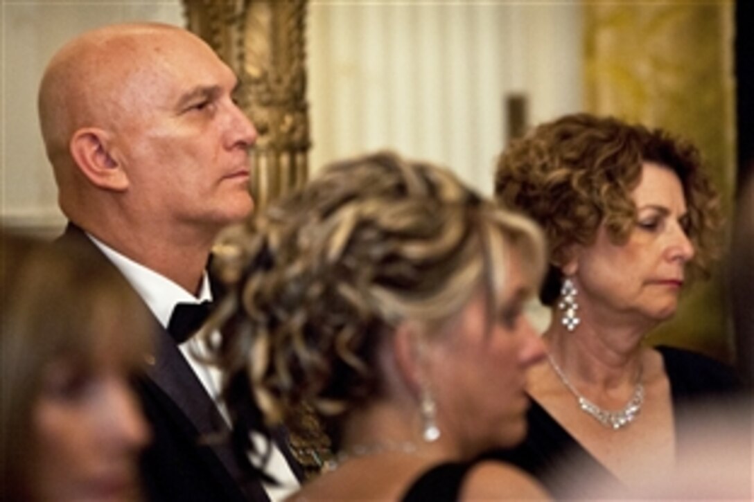 Army Chief of Staff Gen. Raymond T. Odierno, left, and his wife, Linda, right, attend "A Nation's Gratitude Dinner," an event hosted by President Barack Obama and First Lady Michelle Obama to honor Iraq War veterans at the White House in Washington, D.C., Feb. 29, 2012.
